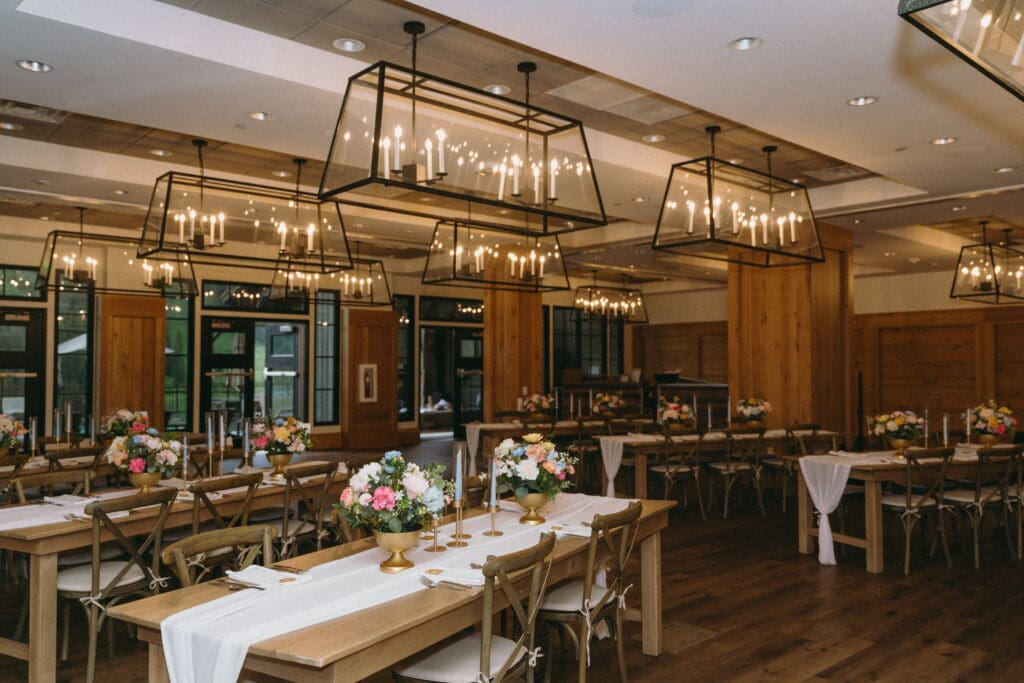 Wedding reception with floral arrangements and candlelight at Snowpine Lodge in Alta, Utah