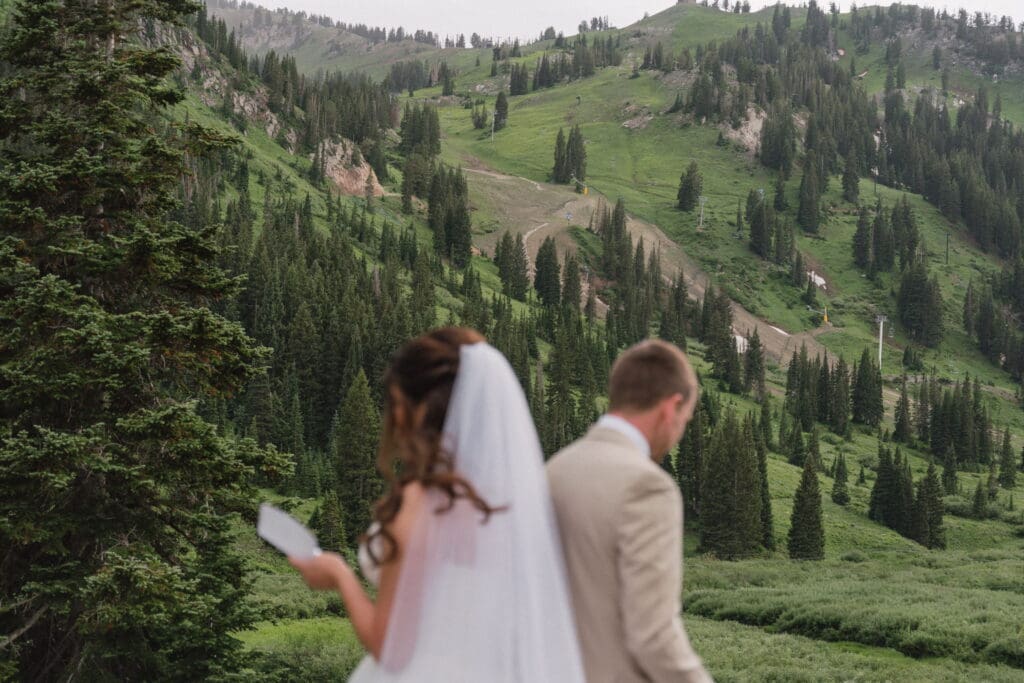 Hailey and Grant overlooking the Wasatch Mountains during their Snowpine Lodge wedding