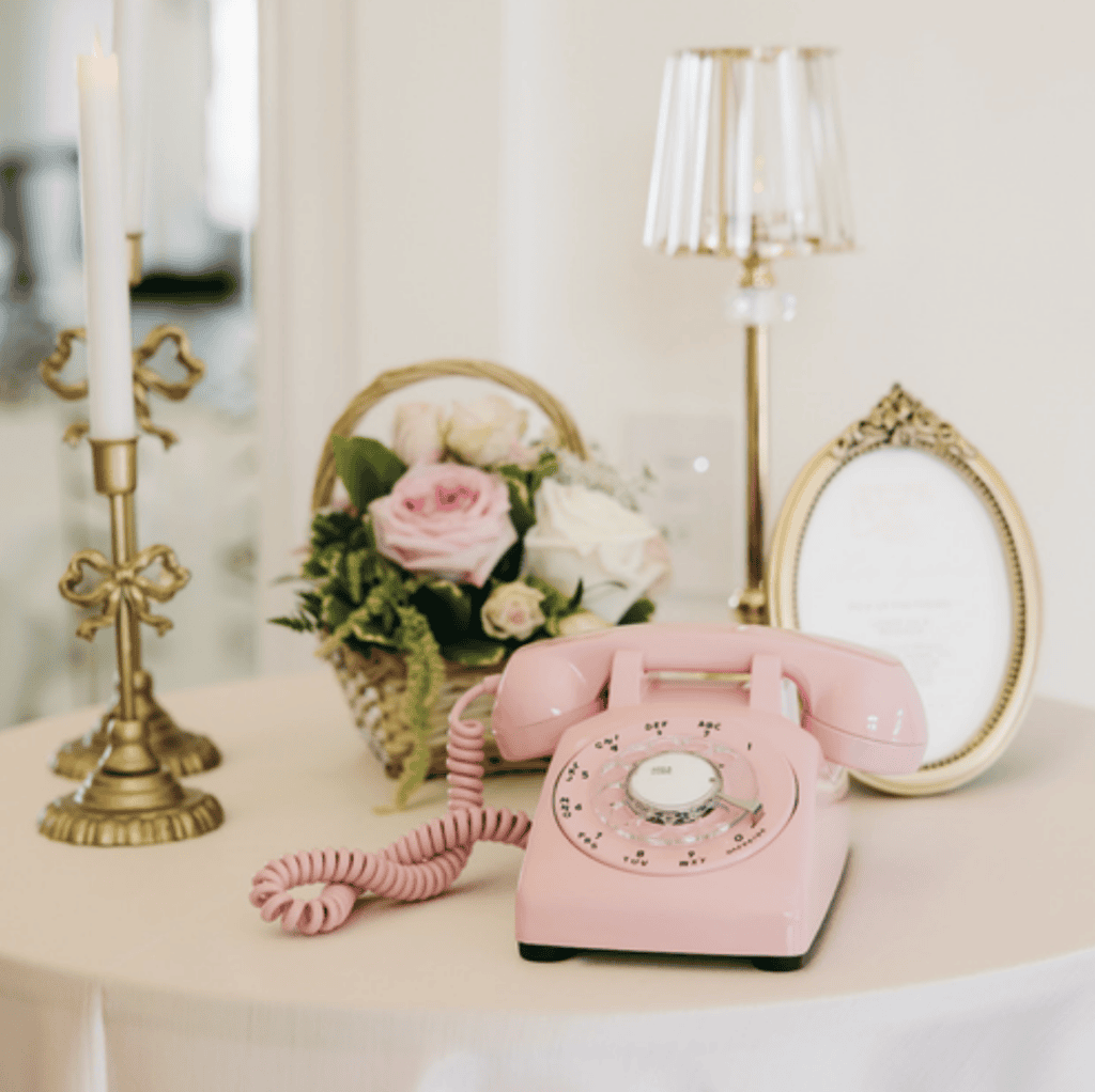 Pink telephone and floral details at Ashley and Alex's Siempre wedding in Draper, Utah