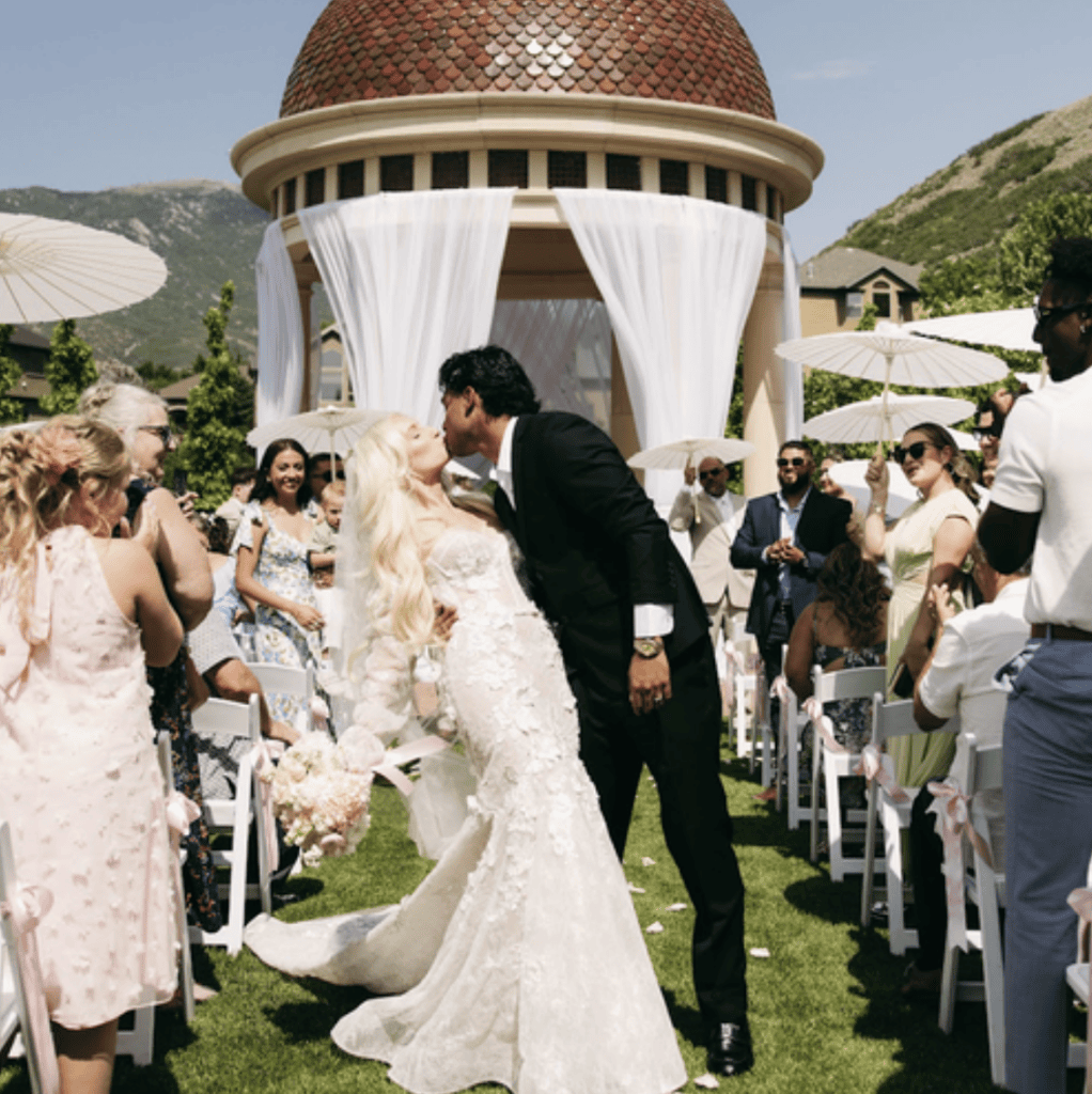Ashley and Alex kissing after their wedding ceremony at Siempre's Rotunda in Draper