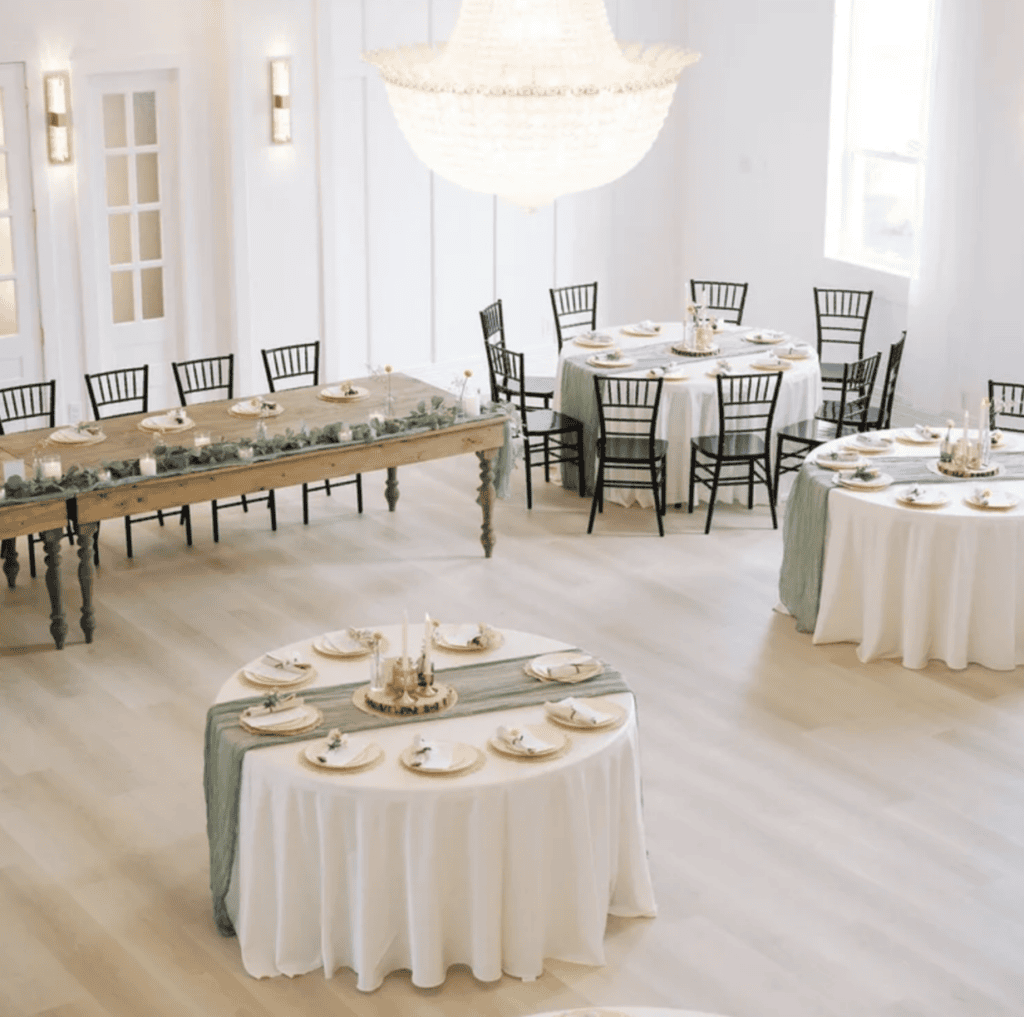 Caidy and Kody's wedding reception at Vode with elegant tables and natural light