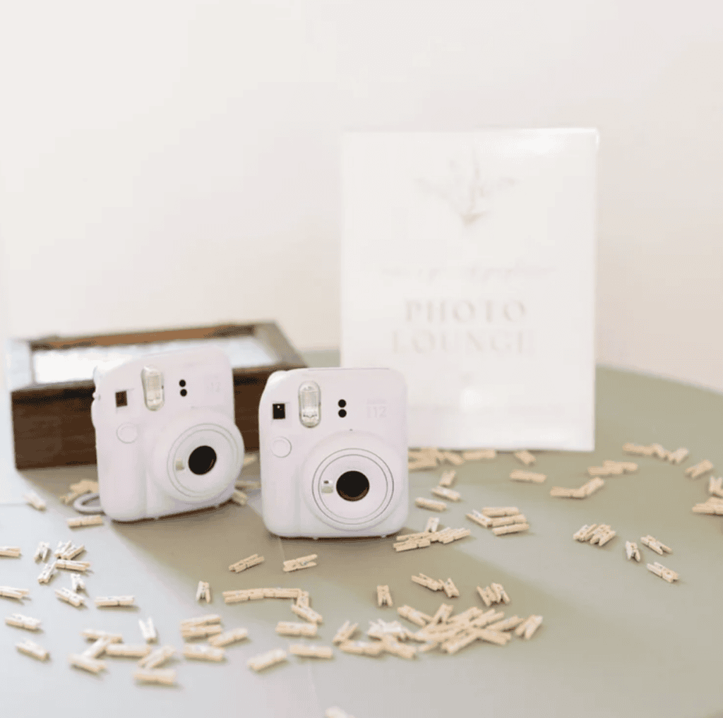 Instant cameras and photo booth details at Caidy and Kody's wedding at Vode